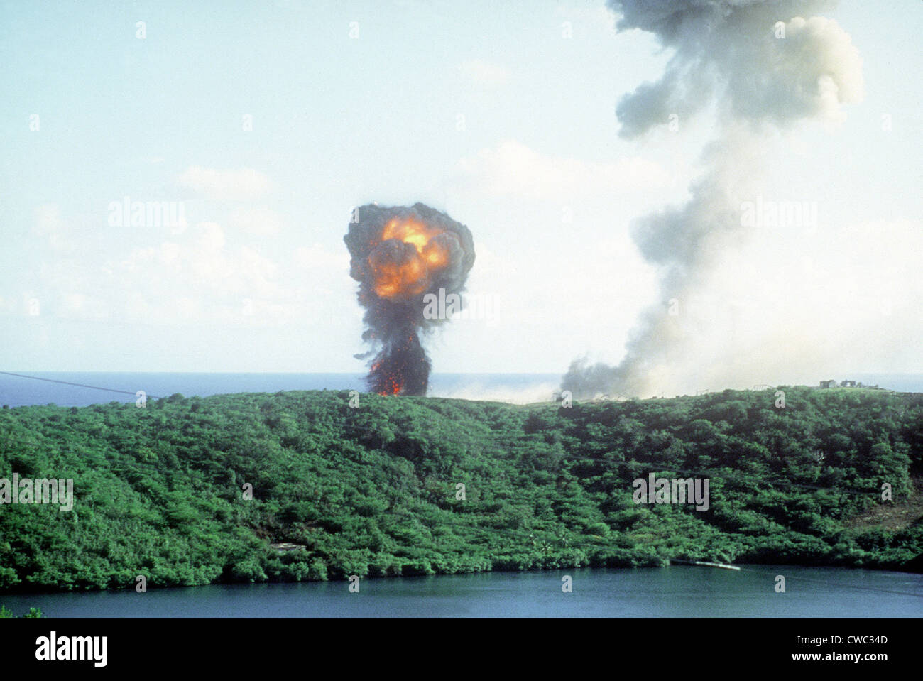 Explosion from a direct U.S. hit on a Grenadian position on the first day of the U.S. lead invasion of the Caribbean island on Stock Photo