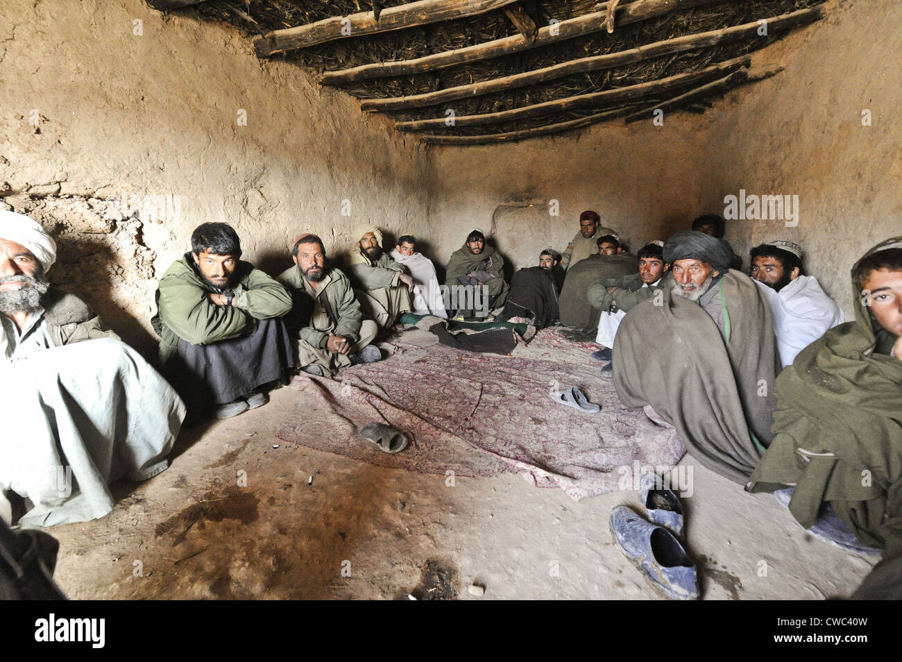 Suspected Taliban detainees held for questioning by Afghan National Army soldiers in Badula Qulp Helmand province Afghanistan Stock Photo
