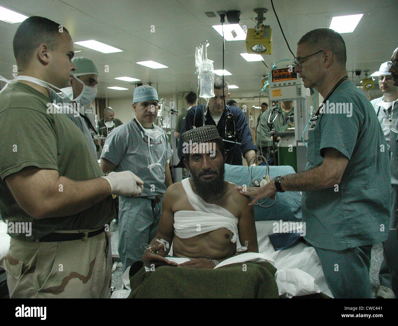 Medical personnel of USS Bataan treat wounded Pashtun soldier from Afghanistan Dec. 6 2001., Photo by:Everett Stock Photo