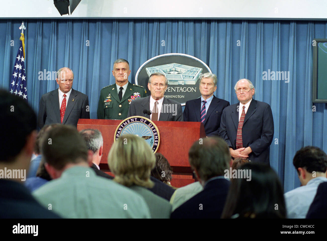 Secretary of Defense Donald H. Rumsfeld center speaks to the press shortly after terrorists crashed American Airlines Flight 77 Stock Photo