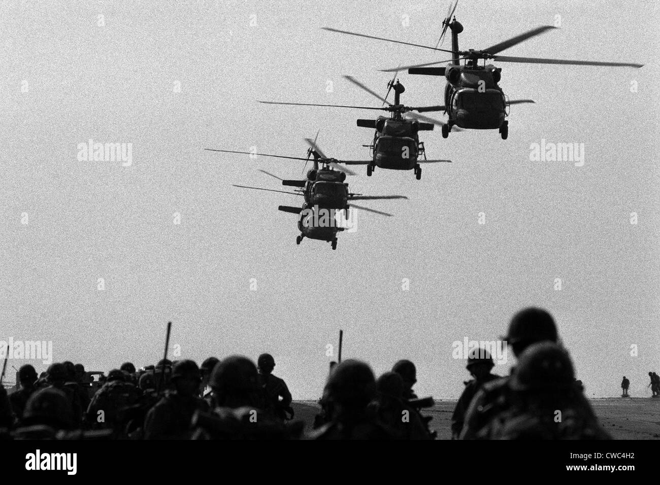 U.S. Army Black Hawk helicopters depart from Point Salines Airfield after bringing troops to the invasion of the Caribbean Stock Photo