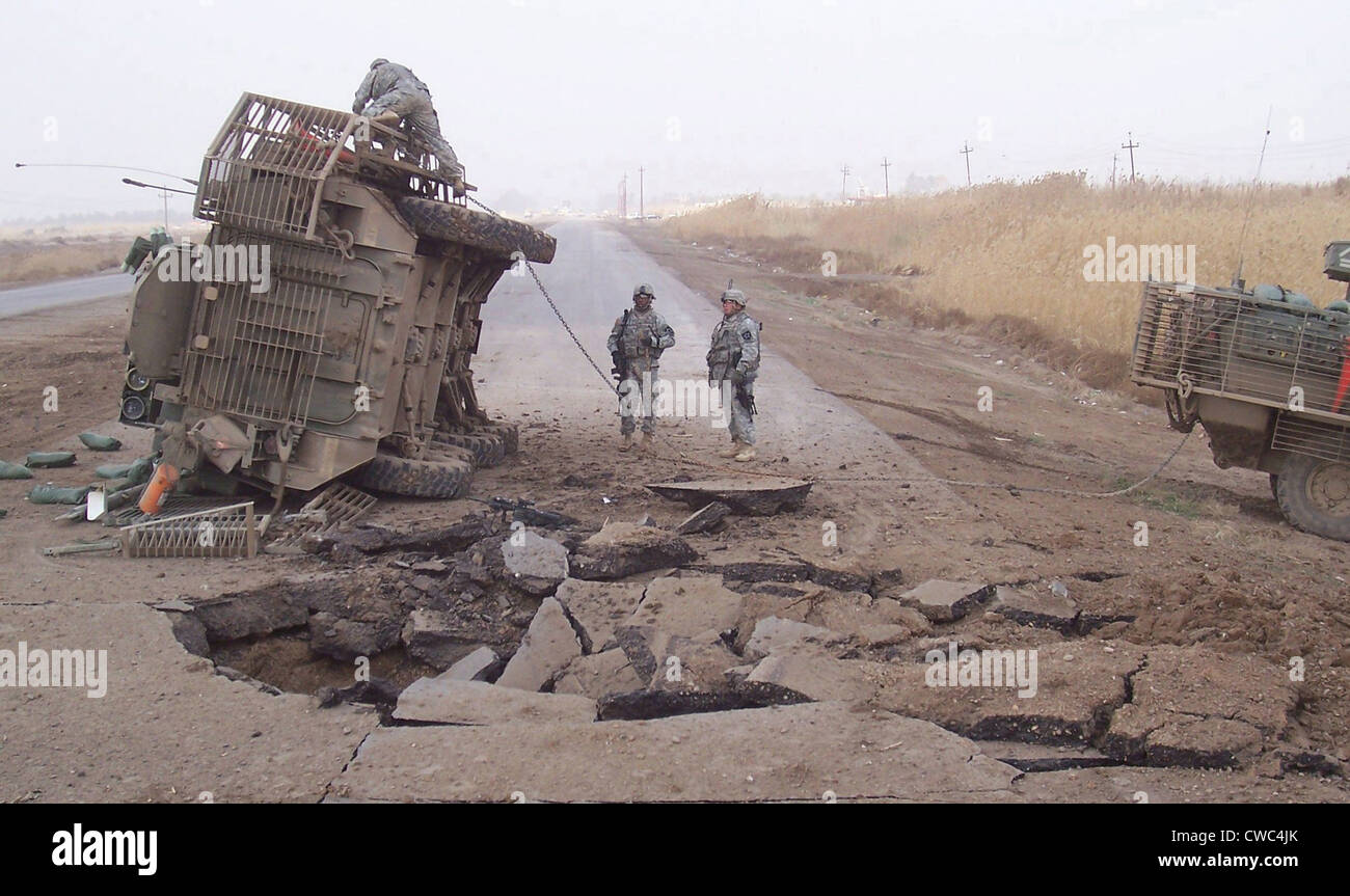 Stryker vehicle lies on its side after surviving a IED blast in 2007. Strykers were introduced into Iraq combat in 2003 filling Stock Photo