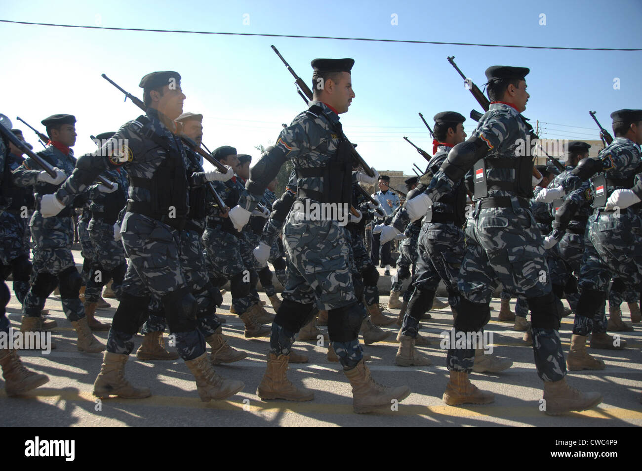 Iraqi police officers march during a parade in their honor near the in Nasiriyah Iraq. Jan. 9 2010. (BSLOC 2011 12 150) Stock Photo