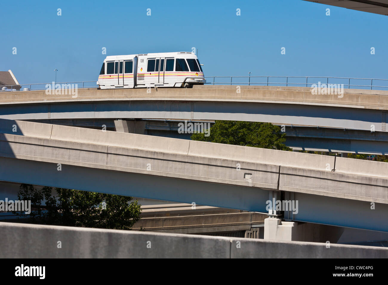 JTA Skyway automated train moves over the Acosta Bridge over the St. Johns River in downtown Jacksonville, FL Stock Photo