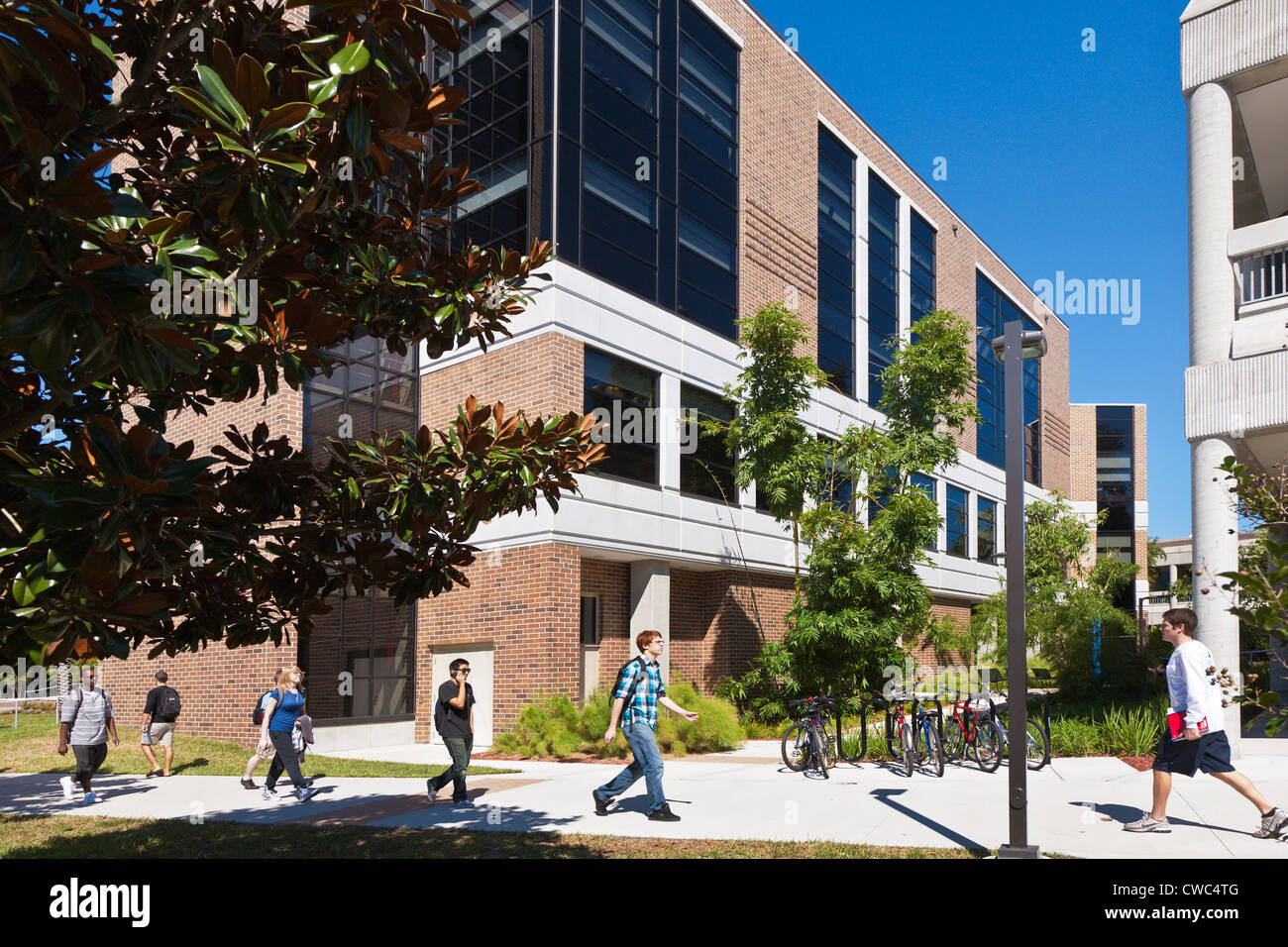 Students walk past the Brooks College of Health building at the University of North Florida in Jacksonville, Florida Stock Photo