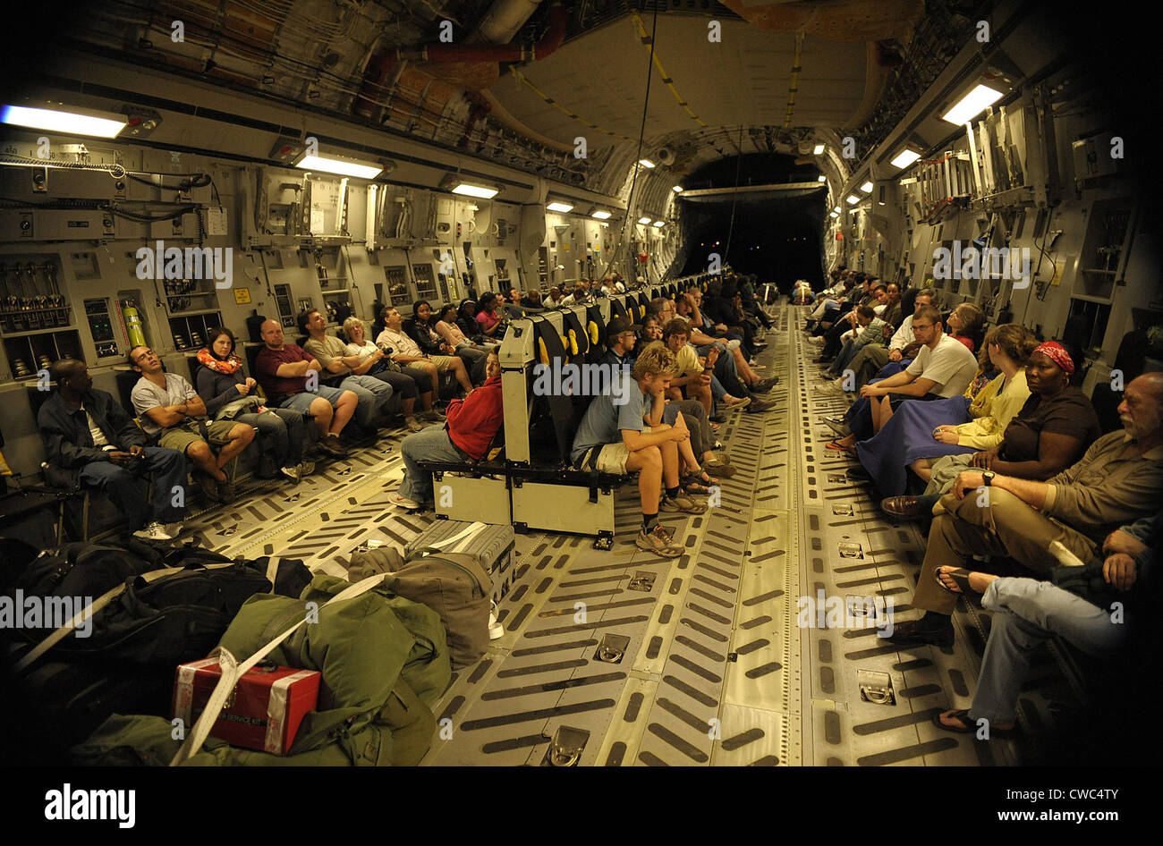 US citizens evacuated from earthquake stricken Haiti in a Air Force C-17 transport. Jan. 15 2010. (BSLOC 2011 12 384) Stock Photo