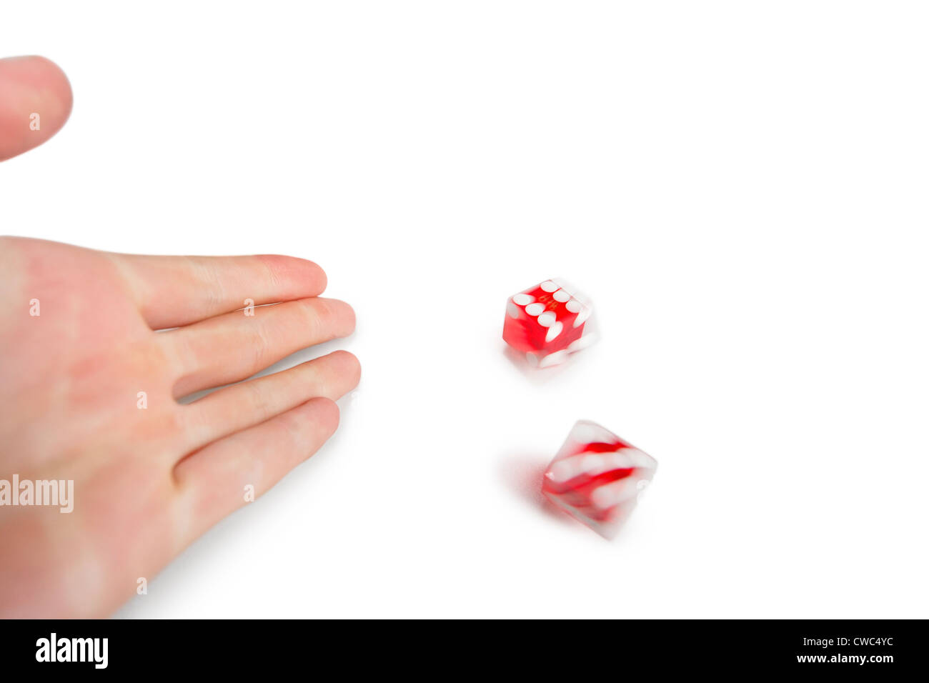 Cropped image of hands throwing gambling dice over white background Stock Photo
