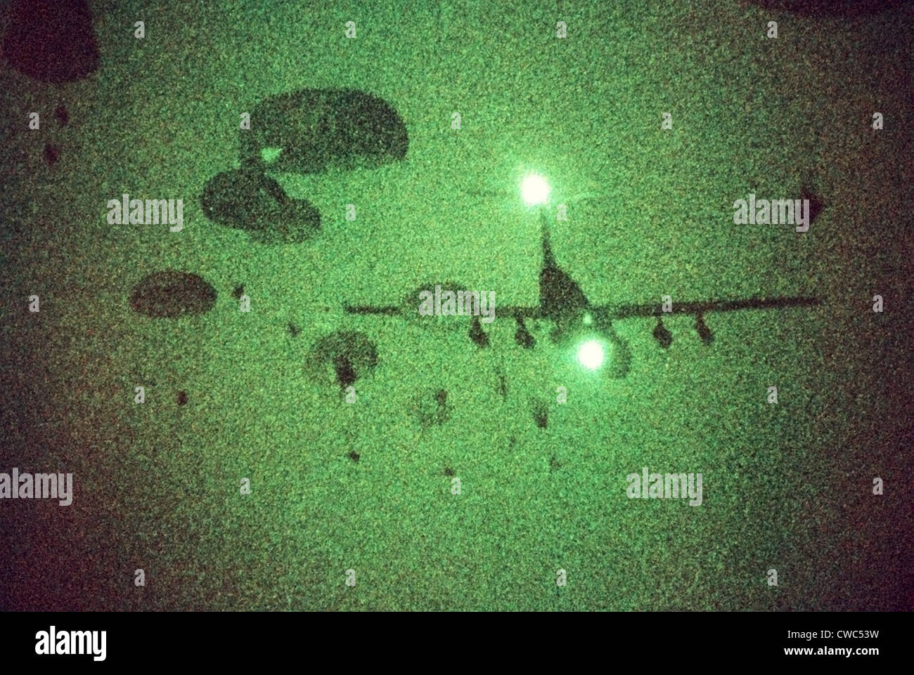 Night vision image of Paratroopers of the 82nd Airborne jumping from C-141 Starlifter aircraft. Sept. 12 1989. Stock Photo