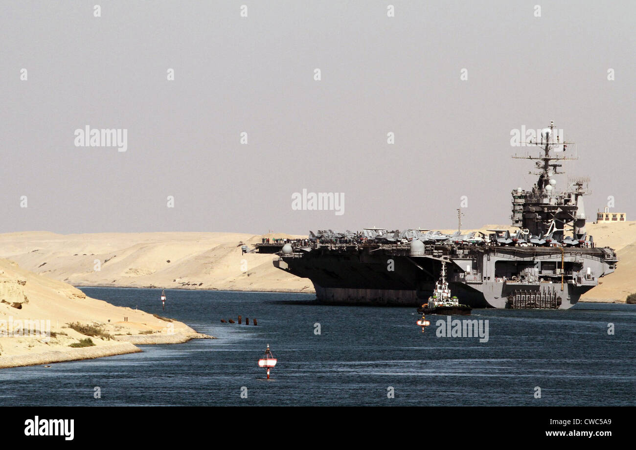 Aircraft carrier USS HARRY S. TRUMAN passes underneath the Suez Canal Bridge in El Qantara Egypt. Dec. 1 2010. Stock Photo