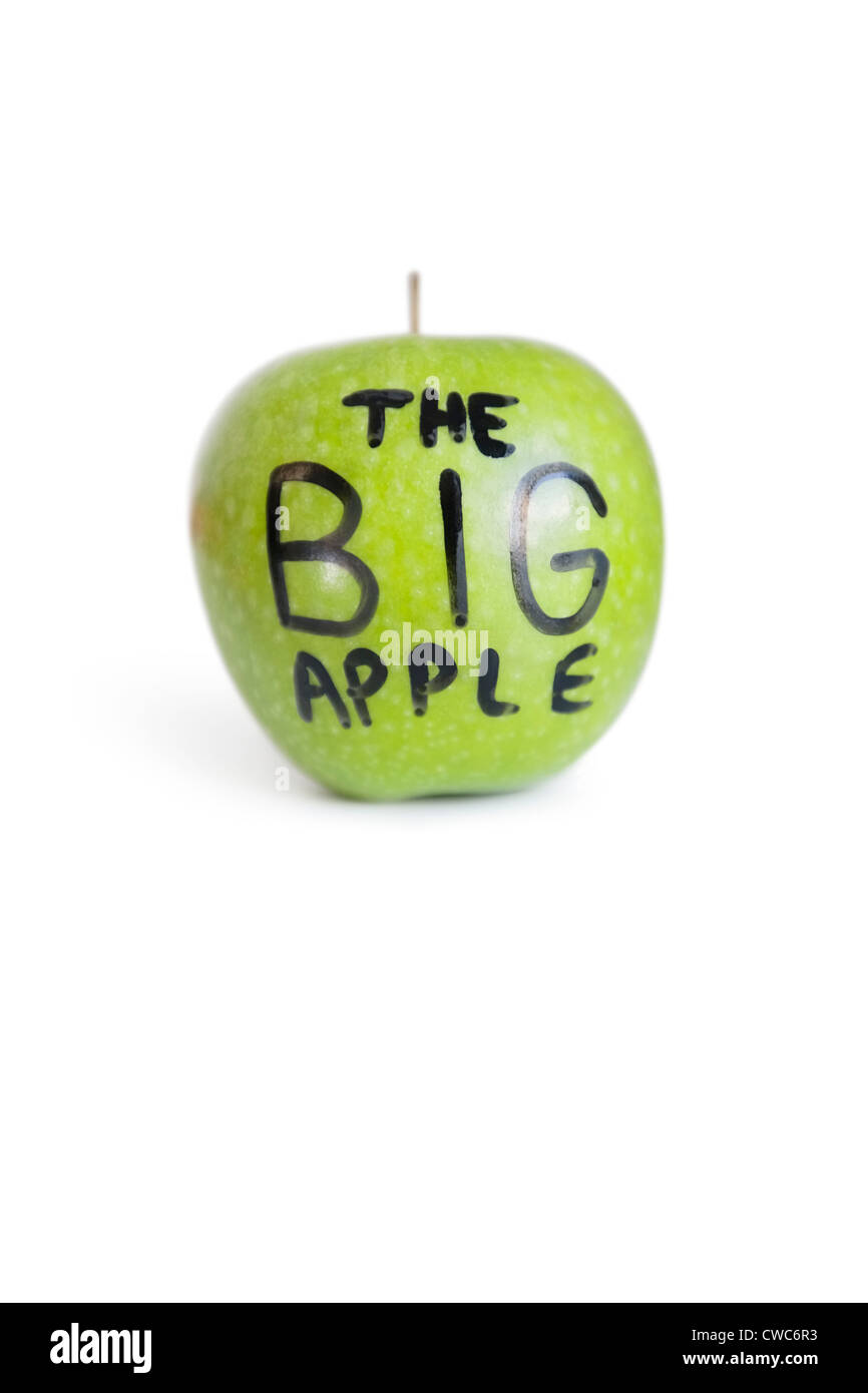 Close-up of text on a green apple over white background Stock Photo