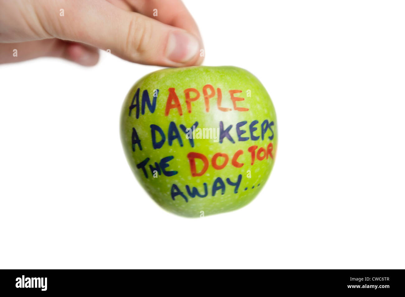 Cropped image of hand holding a granny smith apple with sayings text over white background Stock Photo
