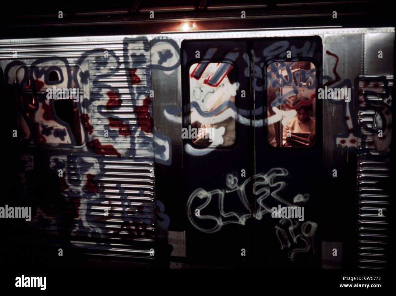 New York City Subway. A subway car with aerosol sprayed paint over in windows and metal of its exterior. New York had a Stock Photo