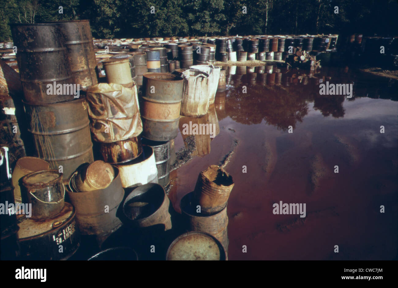 Some of 3 000 drums containing hazardous industrial waste in storage