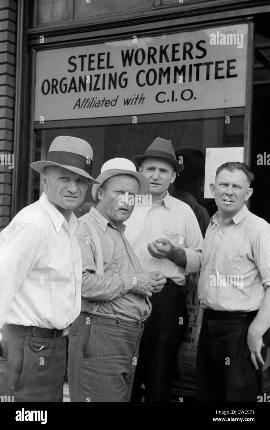 Steelworkers at a Union storefront. The National Labor Relations Act of 1935 gave labor unions unprecedented rights to organize Stock Photo