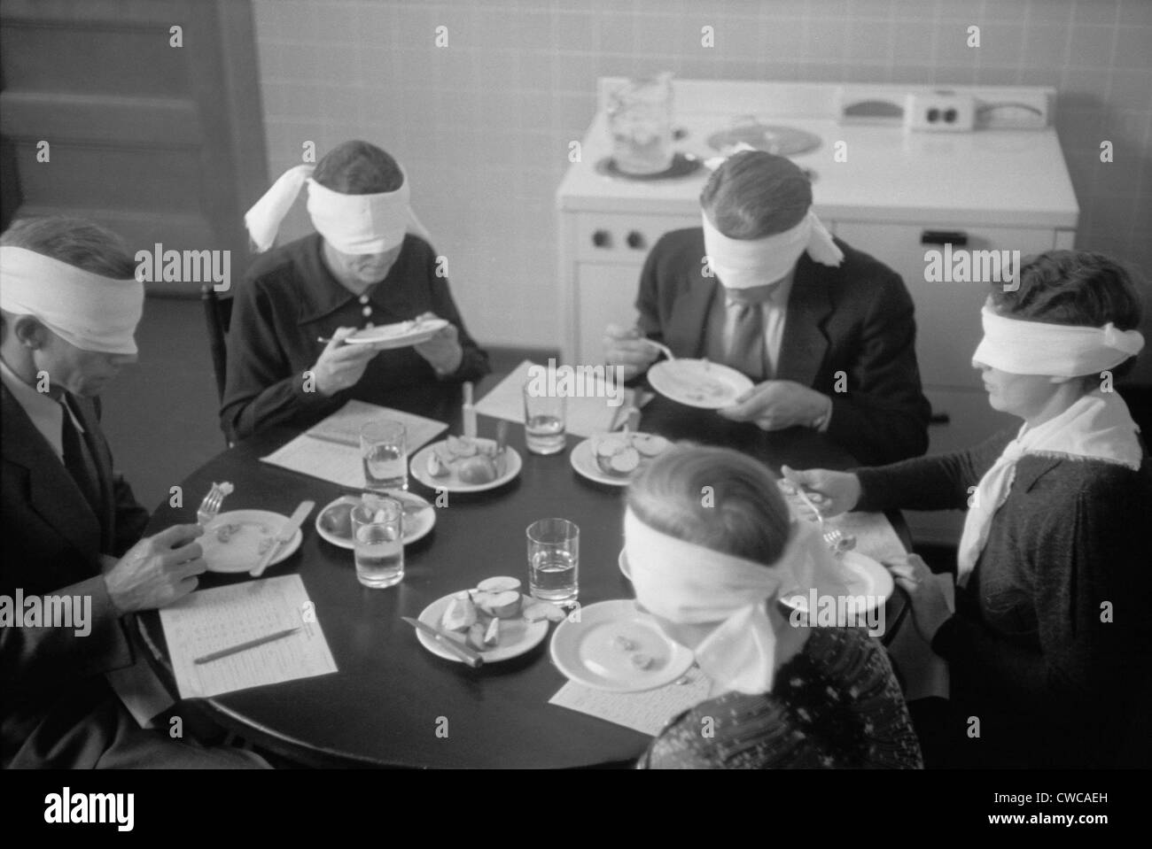 Blindfolded meat testers sampling meats produced on an experimental farm in Prince George's County, Maryland. August 1935 photo Stock Photo