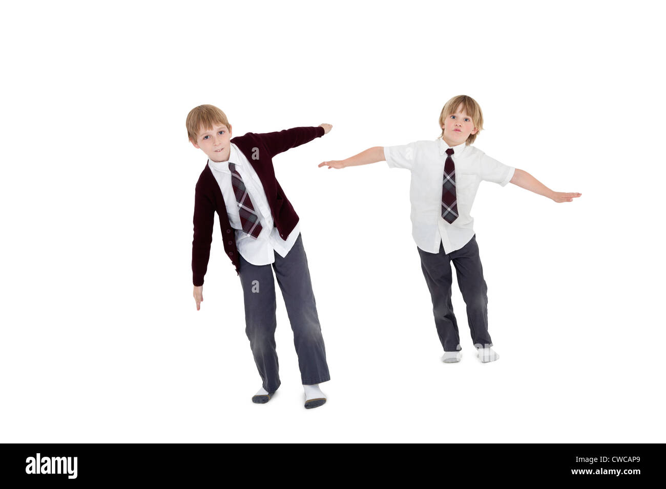 Boys with arms outstretched over white background Stock Photo