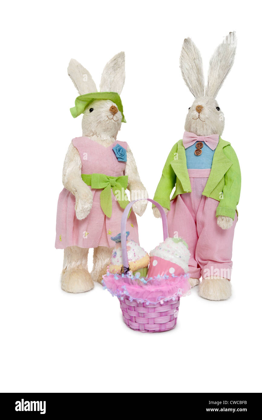 Portrait of stuffed Rabbit couple standing together with basket over white background Stock Photo