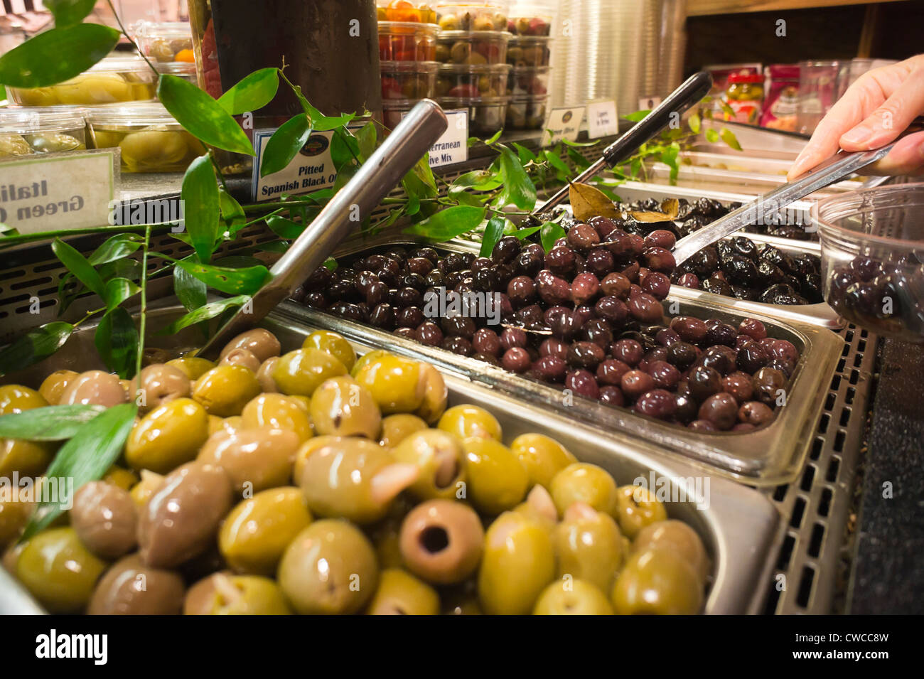 Olives in the olive bar in a supermarket in the Chelsea neighborhood of