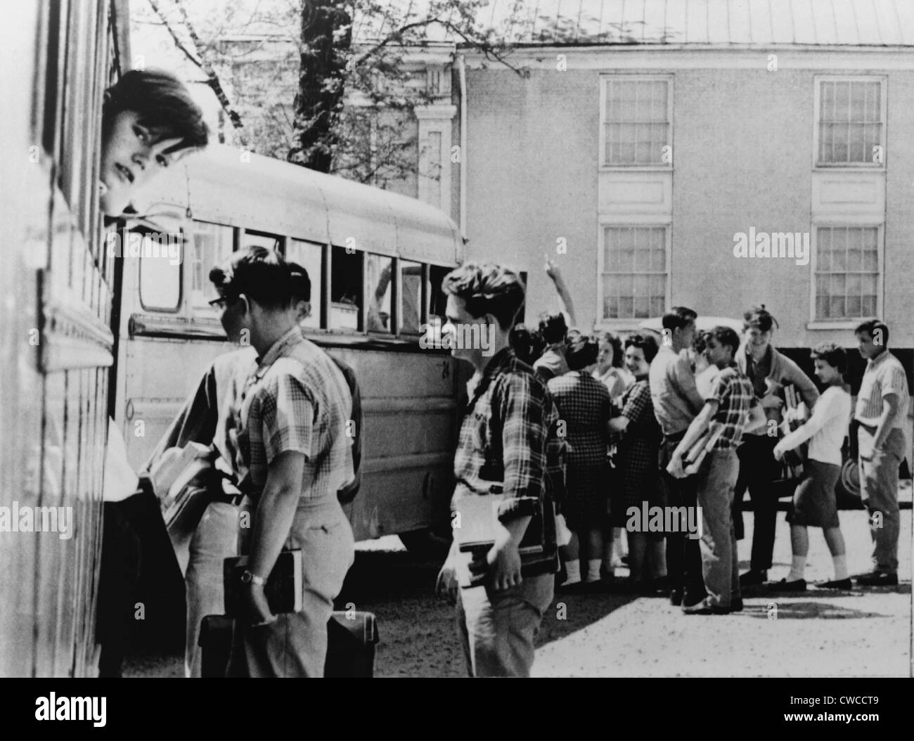 Resisting school integration. White students boarding buses for a