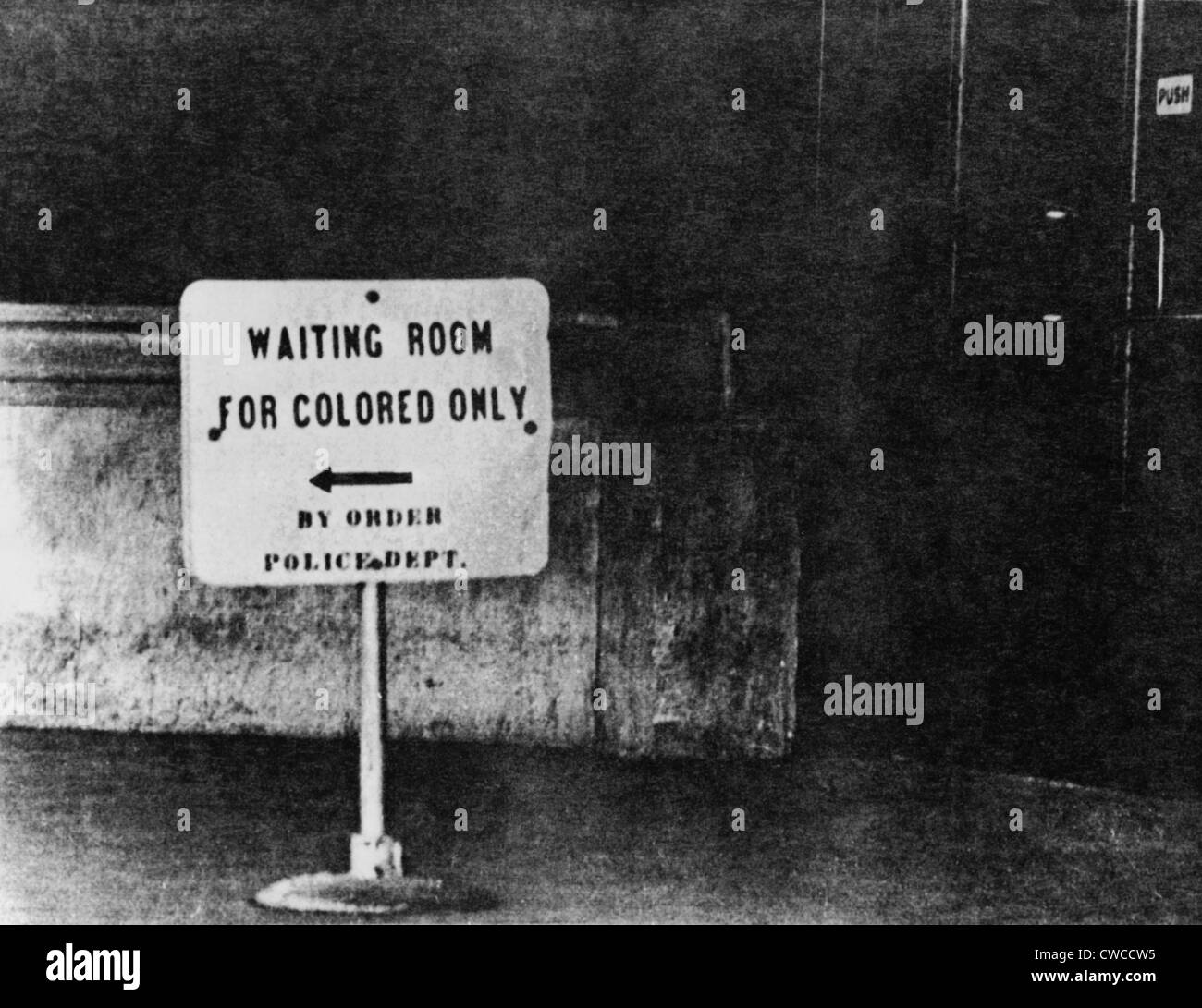 Sign reading 'waiting room for colored only, by order Police Dept.' Ca. 1940s or 1950s. Stock Photo
