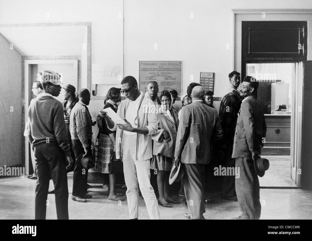 Voter registration drive. African Americans wait at the Circuit Court to register to vote in Mississippi. Ca. 1960s. Stock Photo