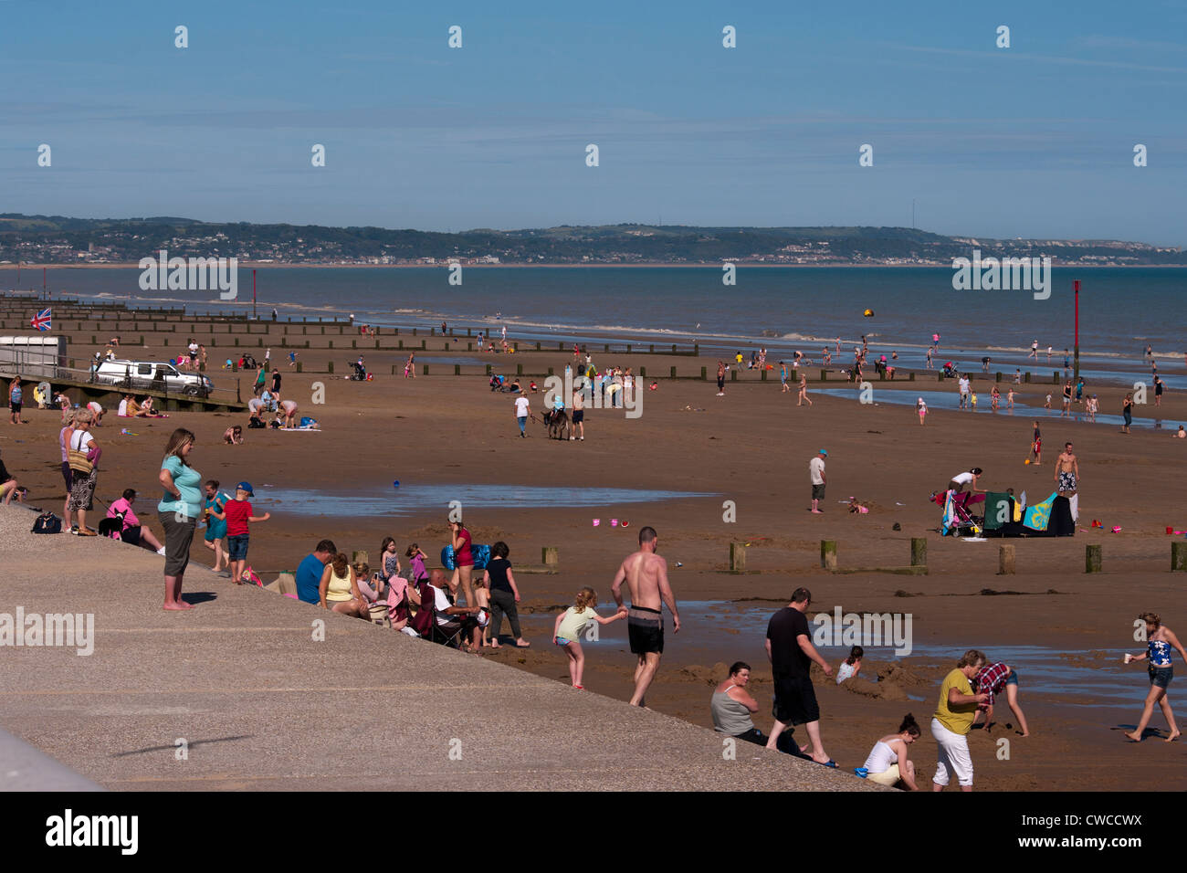 People Having Fun On Dymchurch Beach Kent UK Stock Photo