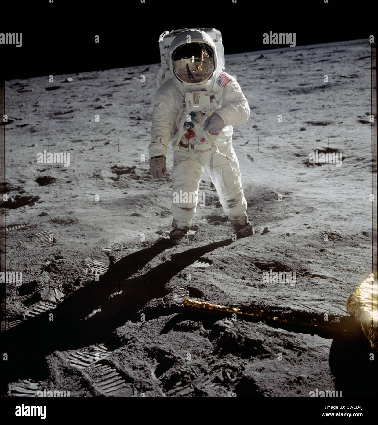 Apollo 11 Astronaut Edwin Aldrin on the Moon. Neil Armstrong and the Lunar Module are reflected in Aldrin's gold visor. July Stock Photo