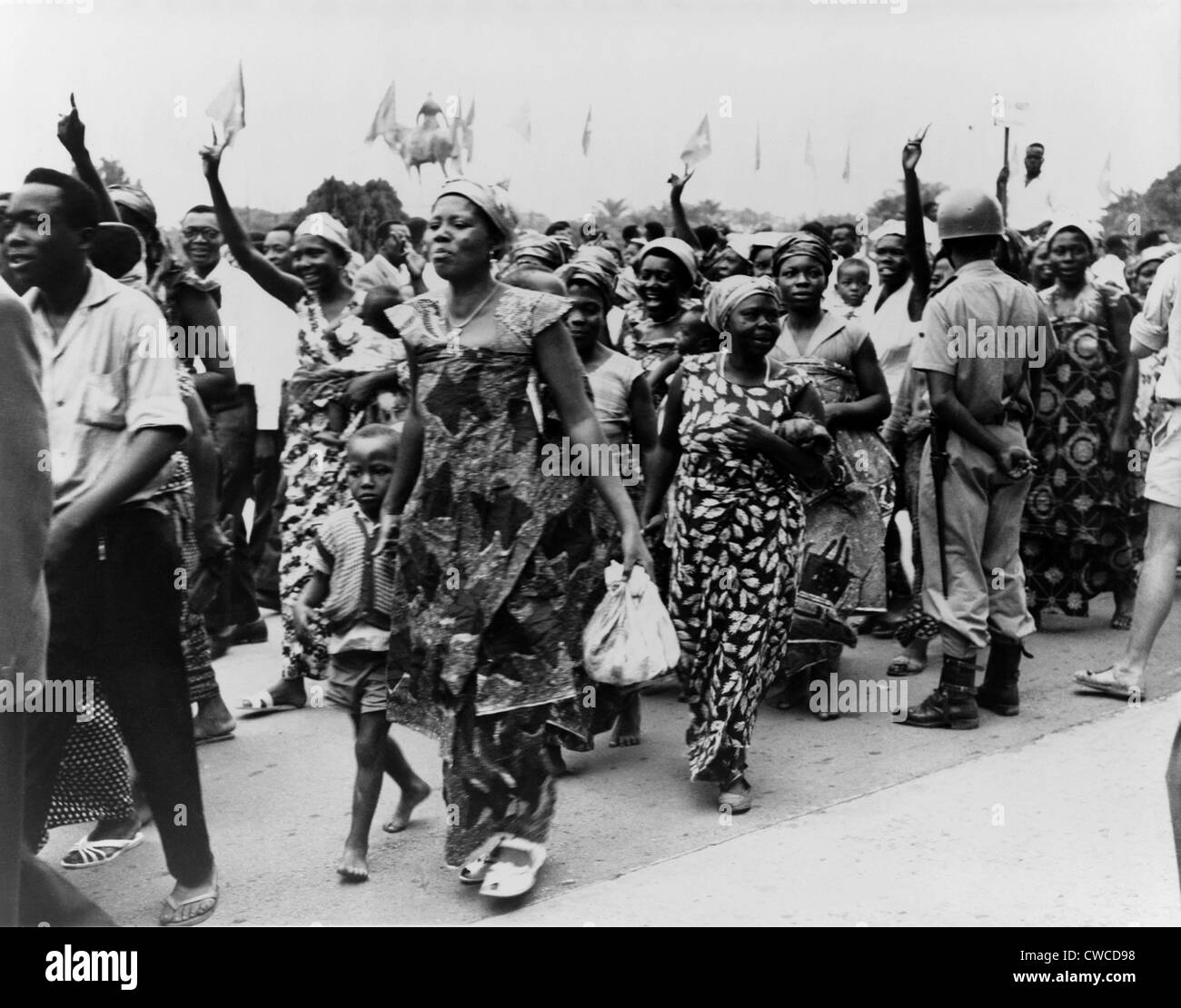 Women and men parade through the streets of Leopoldville in the Belgian Congo celebrating their forthcoming independence. June Stock Photo