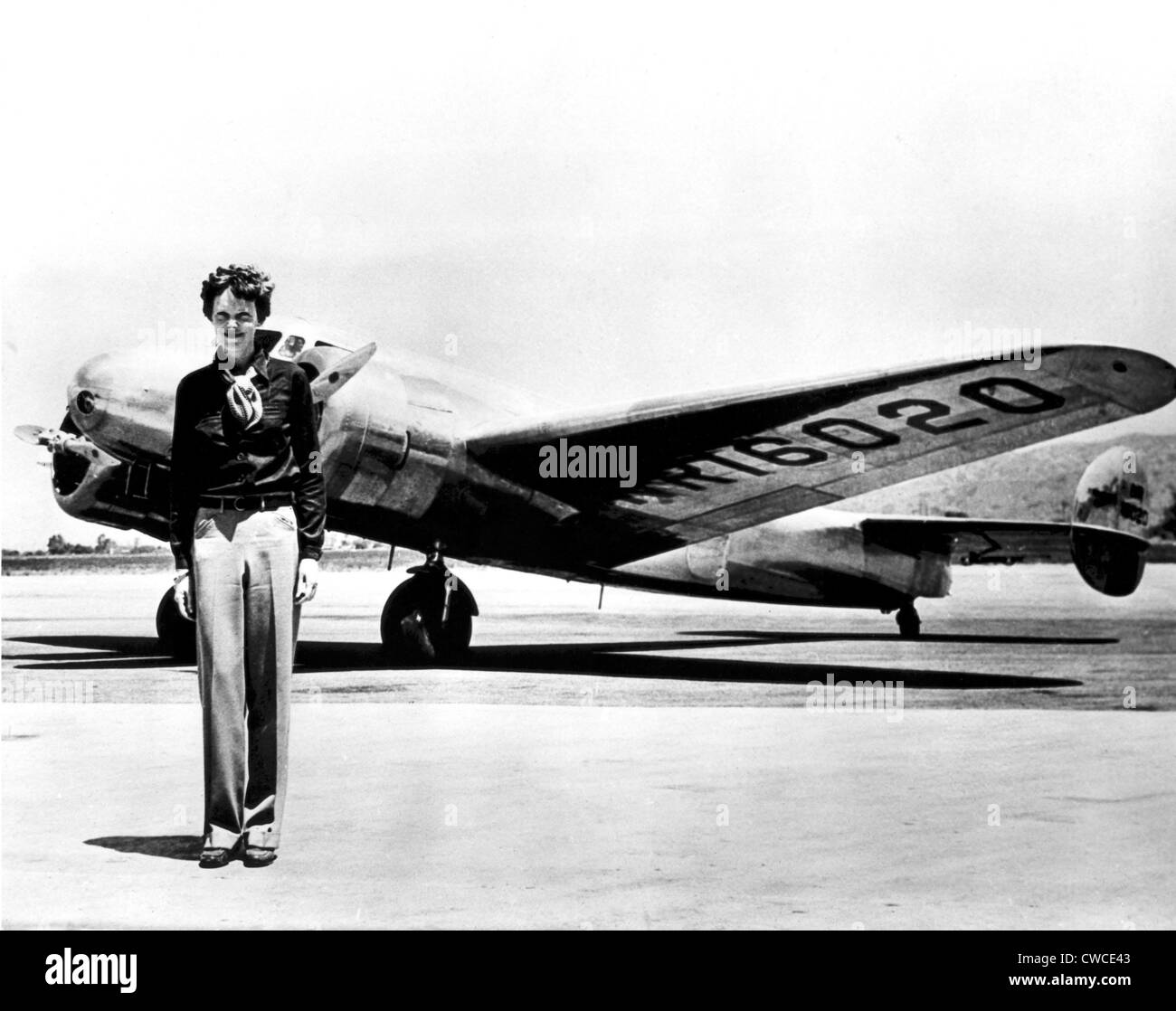 Amelia Earhart standing in front of the Lockheed Electra in which she disappeared in July 29, 1937. Stock Photo