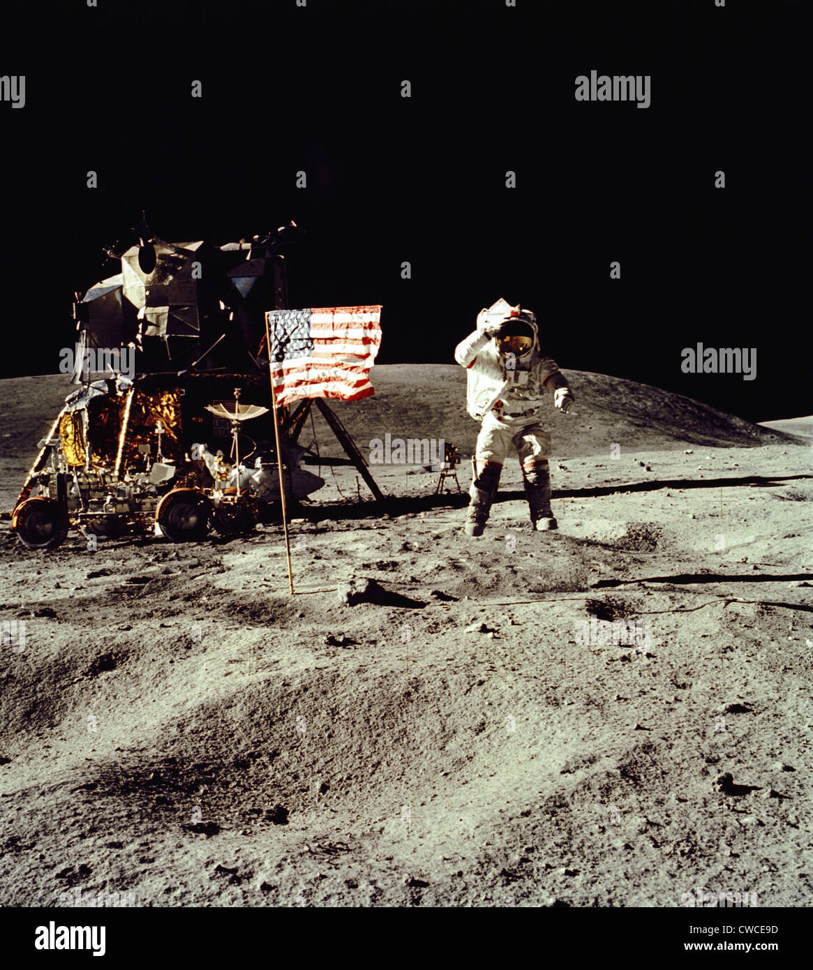 Apollo 16 Astronaut salutes the US flag on the Moon. July 21-24, 1971. Stock Photo