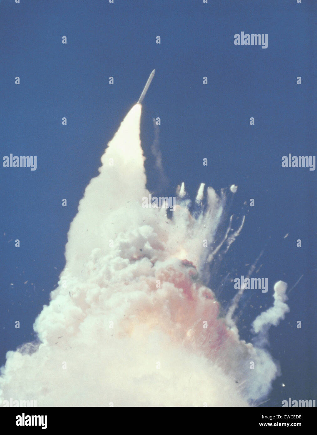 Space shuttle Challenger disaster. 76 seconds into flight, reddish-brown cloud envelops the disintegrating shuttle. Fragments Stock Photo