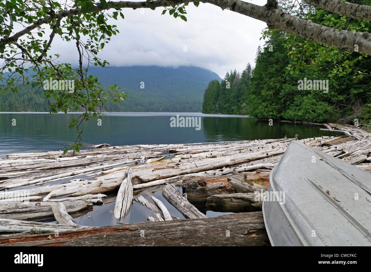 Scenic and uncrowded Unwin Lake in Desolation Sound is viewed from the end of the hiking trail.  The water is warm and clean. Stock Photo