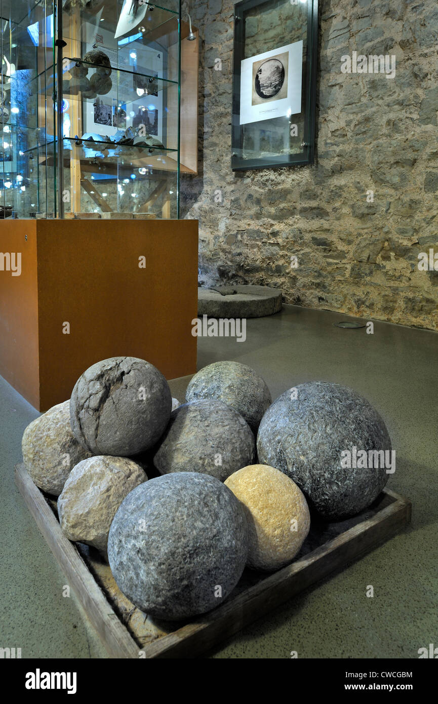 Stone cannonballs in exposition room of the medieval castle Château de Franchimont at Theux in the Belgian Ardennes, Belgium Stock Photo