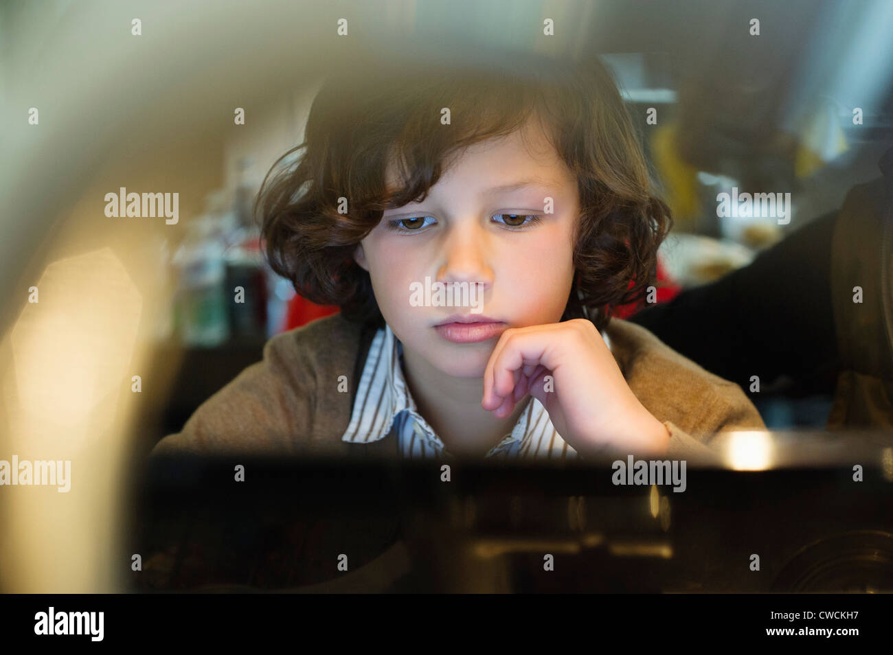 Boy using a laptop Stock Photo - Alamy