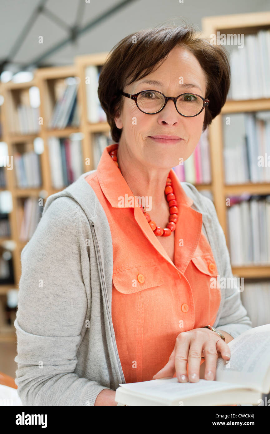 Portrait of a woman reading a book Stock Photo