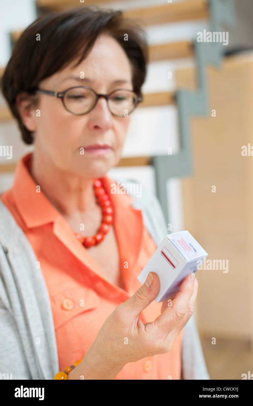 Woman reading a prescription Stock Photo