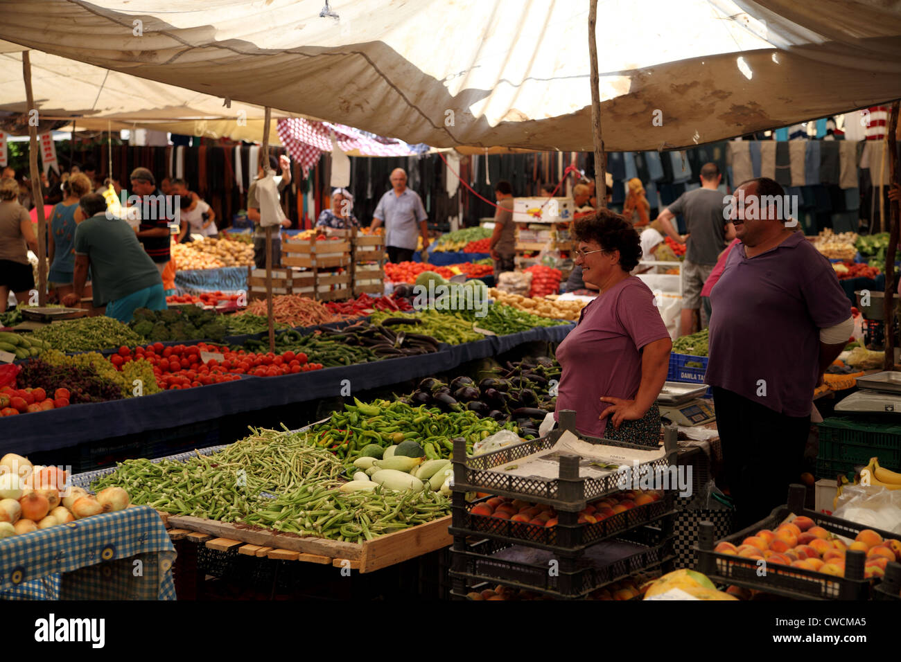 View of Turkish market in Koycegiz, a town near Dalyan, Turkey man and woman looking and smiling Stock Photo