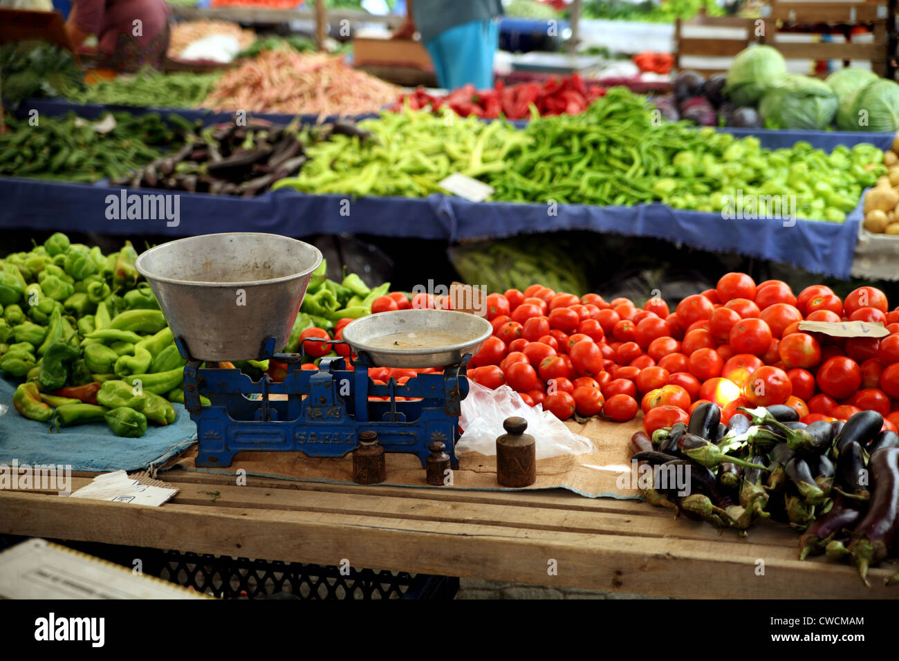 View of Turkish market in Koycegiz, a town near Dalyan, Turkey with scales in foreground with vegetables Stock Photo
