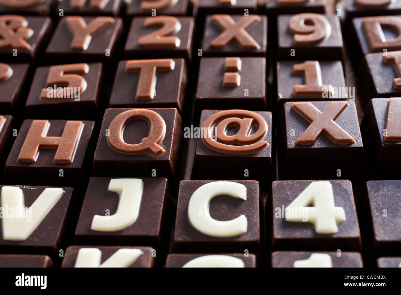 Chocolates with the at symbol, letters and words Stock Photo Alamy