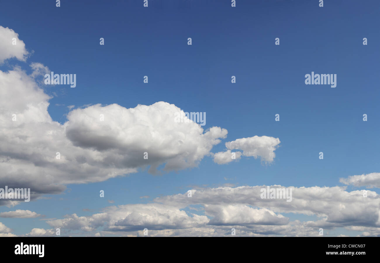 Big white clouds on blue sky summer Stock Photo - Alamy