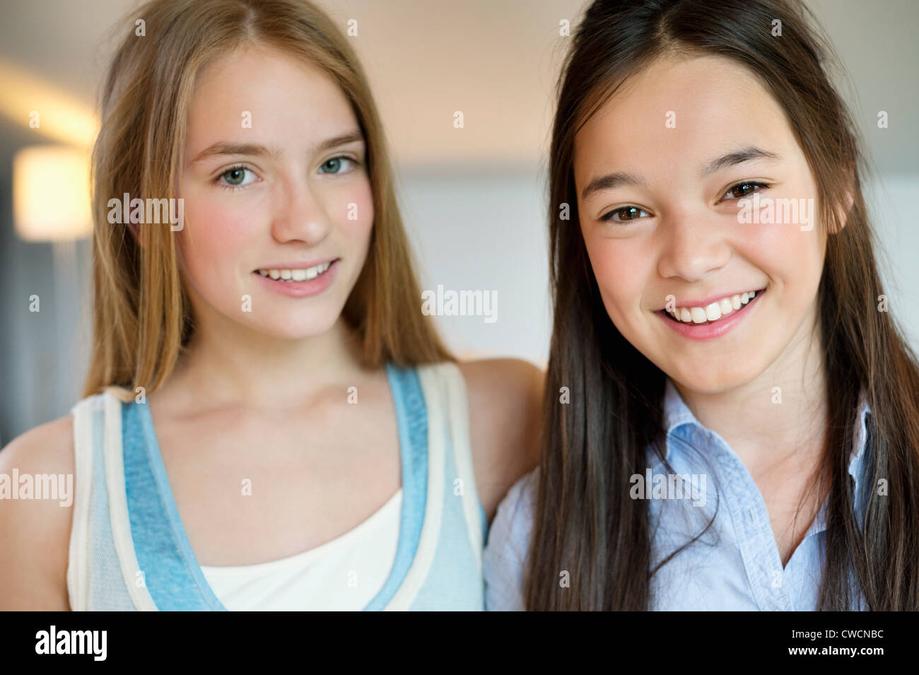 Portrait of two girls smiling Stock Photo - Alamy