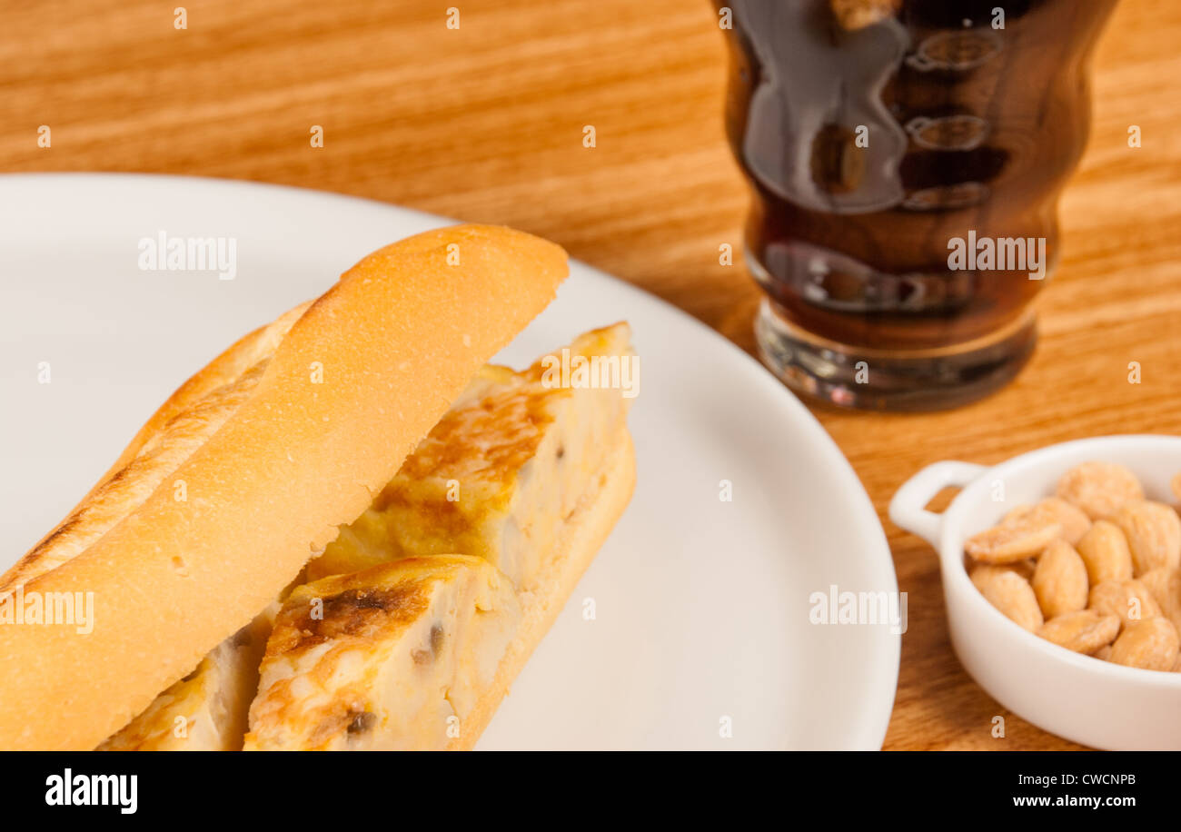 Traditional Spanish sandwich filled with a potato omelette Stock Photo