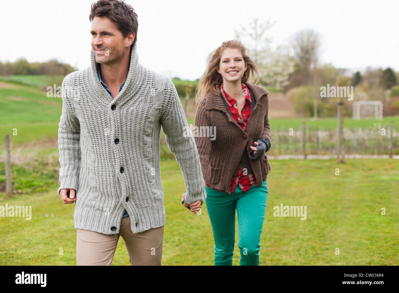 Couple playful holding hands hi-res stock photography and images - Alamy