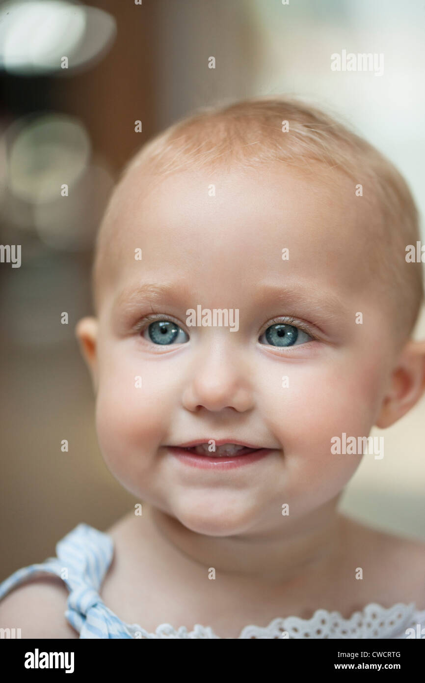 Close-up of a baby girl smiling Stock Photo - Alamy