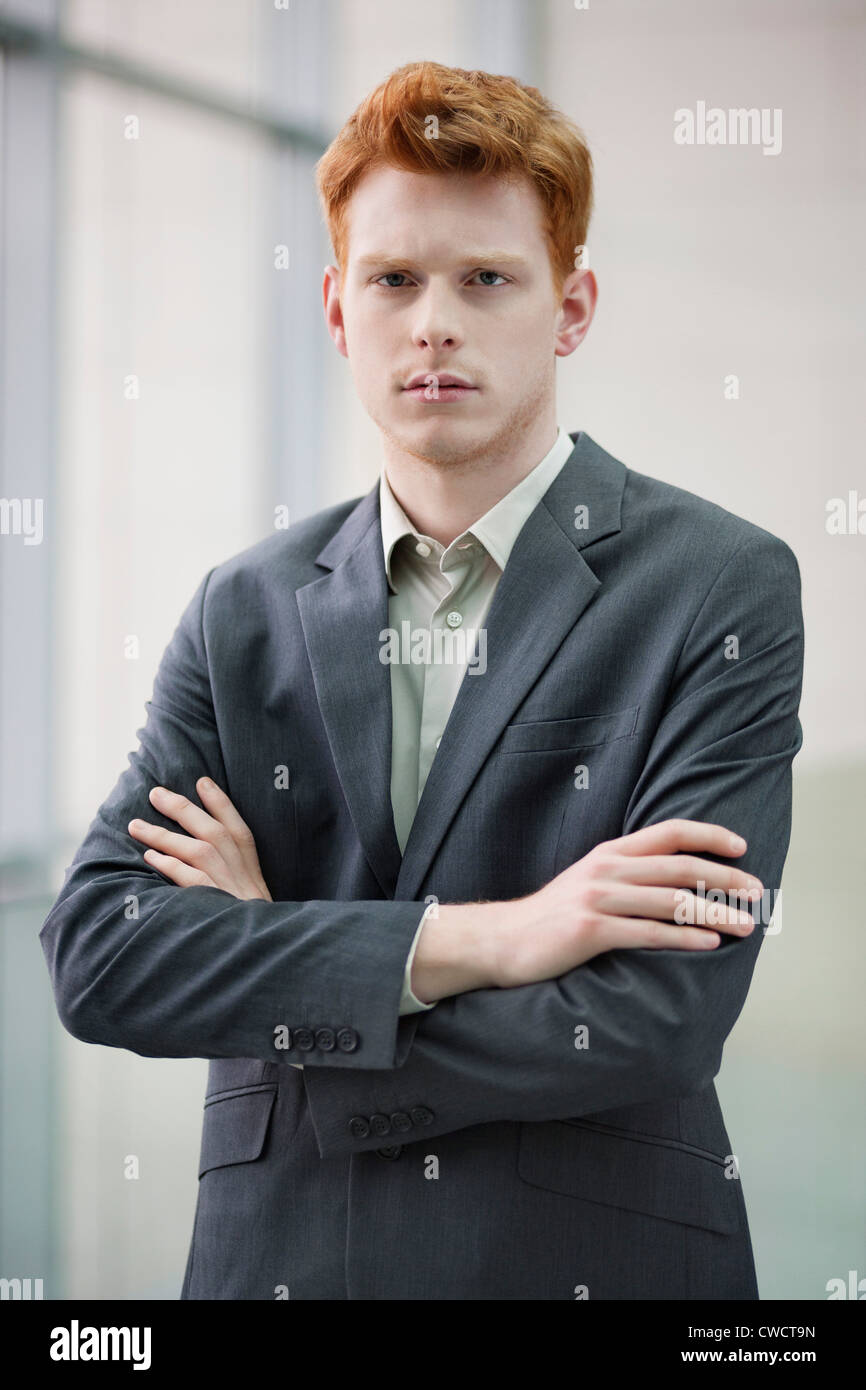 Portrait of a businessman with arms crossed in an office Stock Photo ...