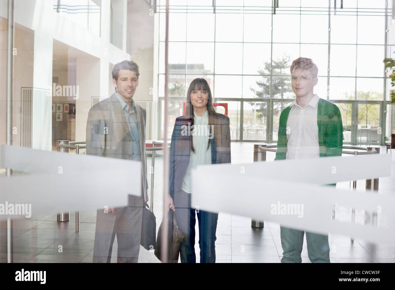 Portrait of business executives in an office lobby Stock Photo - Alamy