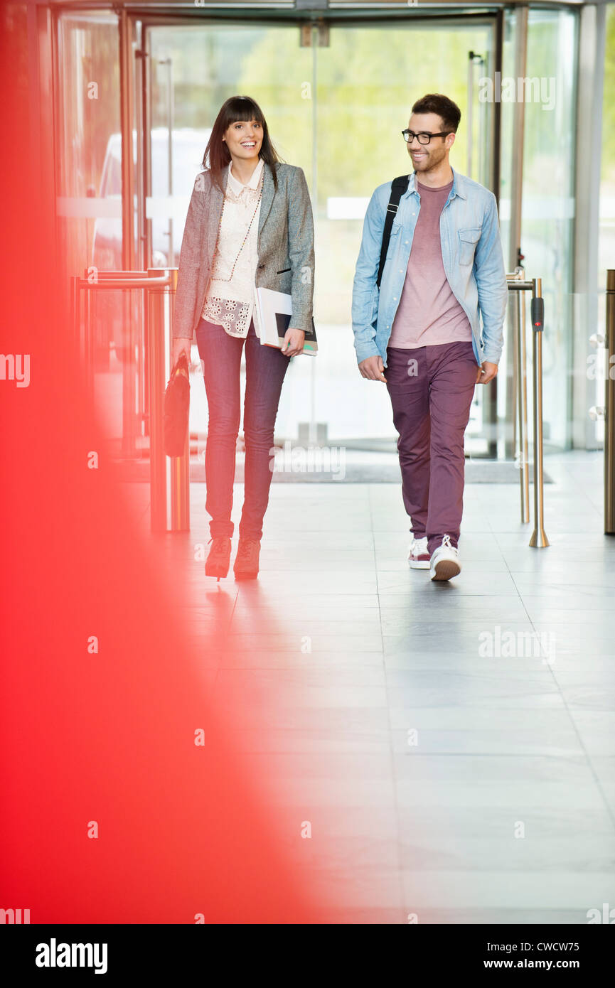Business executives entering in an office lobby Stock Photo - Alamy