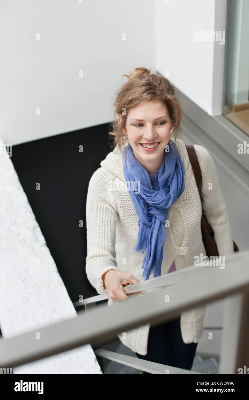 Woman moving up stairs Stock Photo Alamy