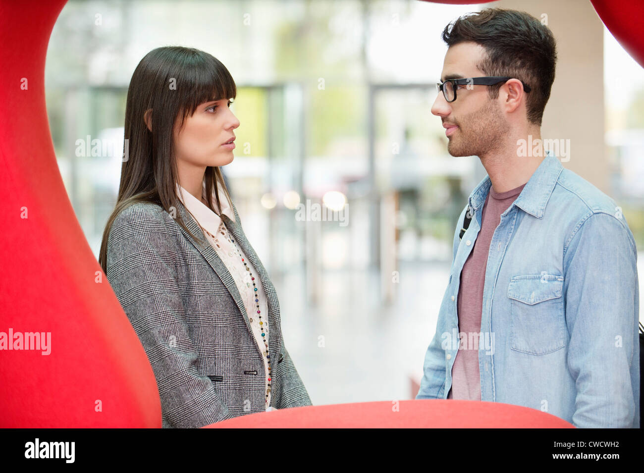 Business executives discussing in an office lobby Stock Photo - Alamy