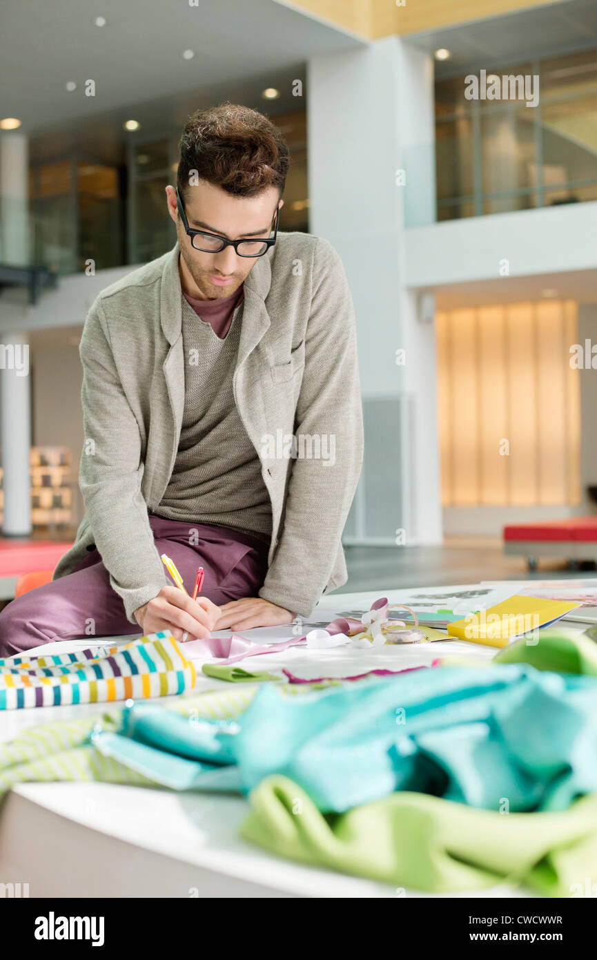 Male fashion designer working in an office Stock Photo